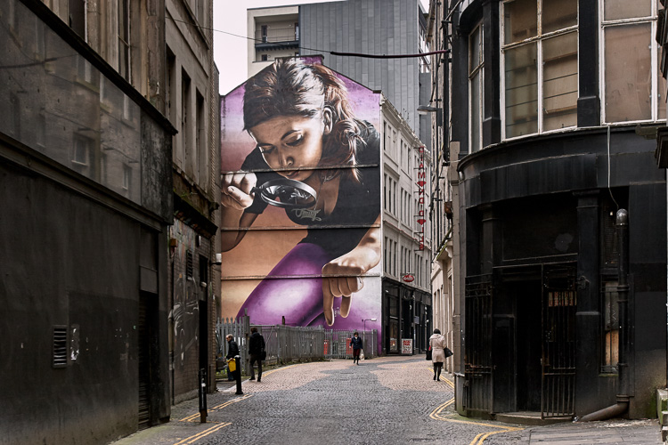 Glasgow street art by Smug - Girl Examining the Passersby