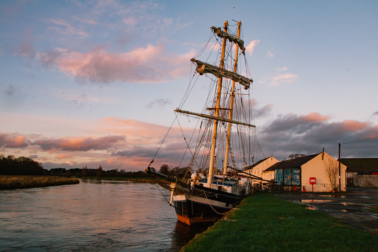 Tall ship La Malouine bathed in winter sunset light at Kingholm Quay