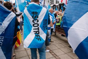 People wrapped in Scottish flags