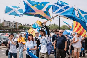 Scottish EU remainers stars, saltire and Catalan flags in All Under One Banner rally in Dumfries