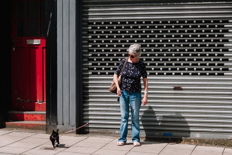 Dumfries street photographs – a woman with her pug