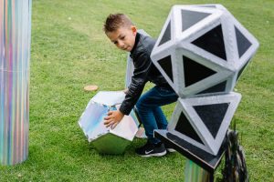 Boy building with magic shapes
