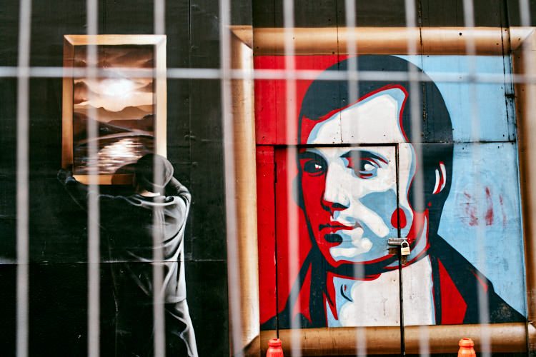 Smug's gallery mural "behind bars"